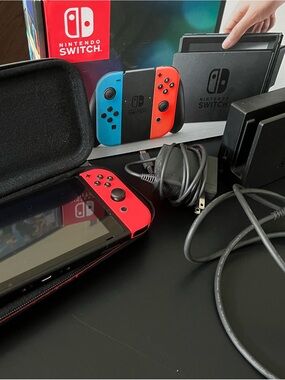 Nintendo Switch console with Neon Red and Neon Blue Joy-Con Controllers